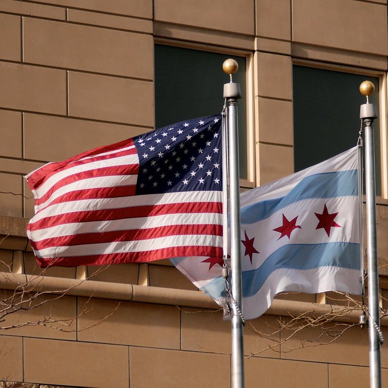 Flag of the United States of America and Chicago Flag flying next to each other